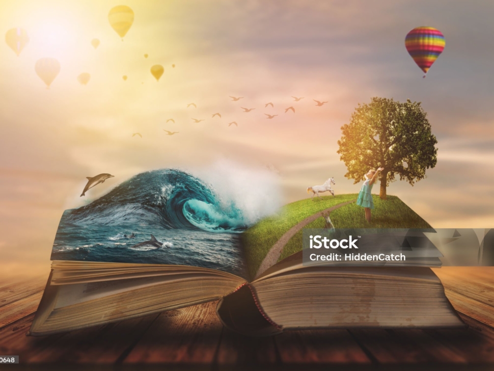 Concept of an open magic book; open pages with water and land and small child. Fantasy, nature or learning concept, with copy space